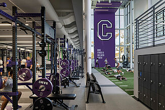 Cornell College - Athletic Performance and Turf View of the Cornell College, lower level athletic performance facility and the seamless transition with the turf area. The facility utilized REGUPOL aktiv flooring to provide a durable surface for athletes.