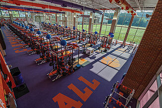 Aerial view of Clemson's weight lifting facility for athletes. Featuring purple REGUPOL flooring, with the logo inlaid into the floor.