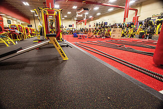 Fitness members working out on Retro Fitness's turf area.